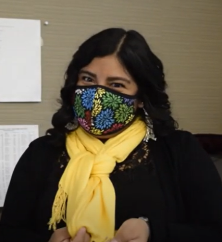 Senorita Montufar explains the significance of the color yellow during Day of the Dead.