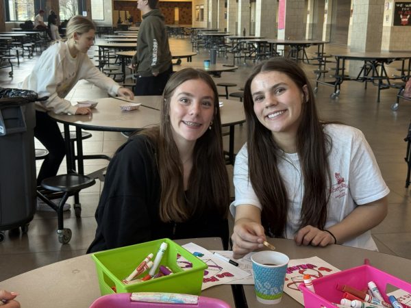 Sisters KJ and Chloe Jacobson celebrate at Unified club's Cookies, Crafts, and Cocoa event in the Ferris Commons. Photo provided by Unified Club